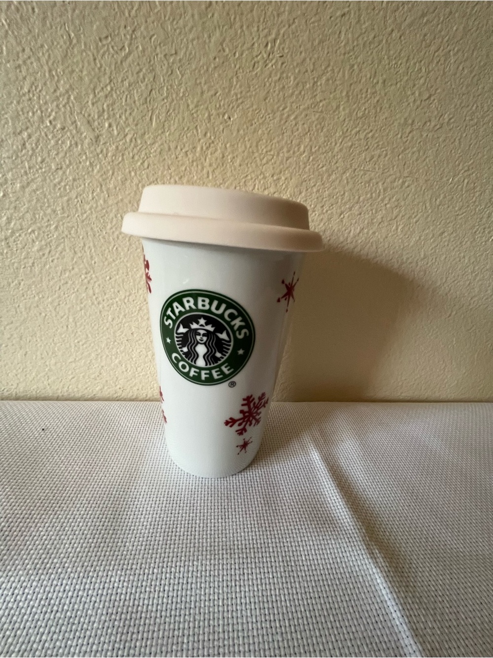 Starbucks White Cup with Green Logo and Red Snowflake Accents